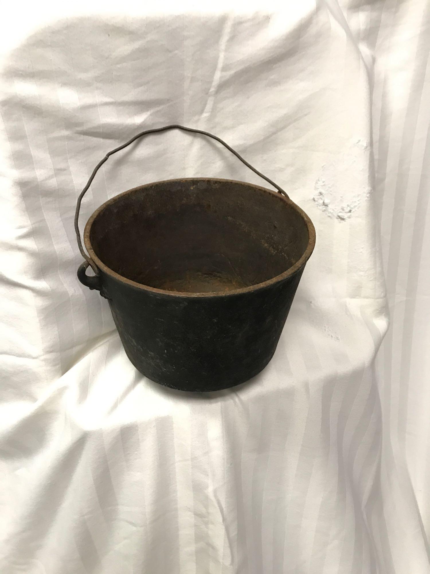 Cast Iron Bucket: Rusty Cast Iron Bucket.