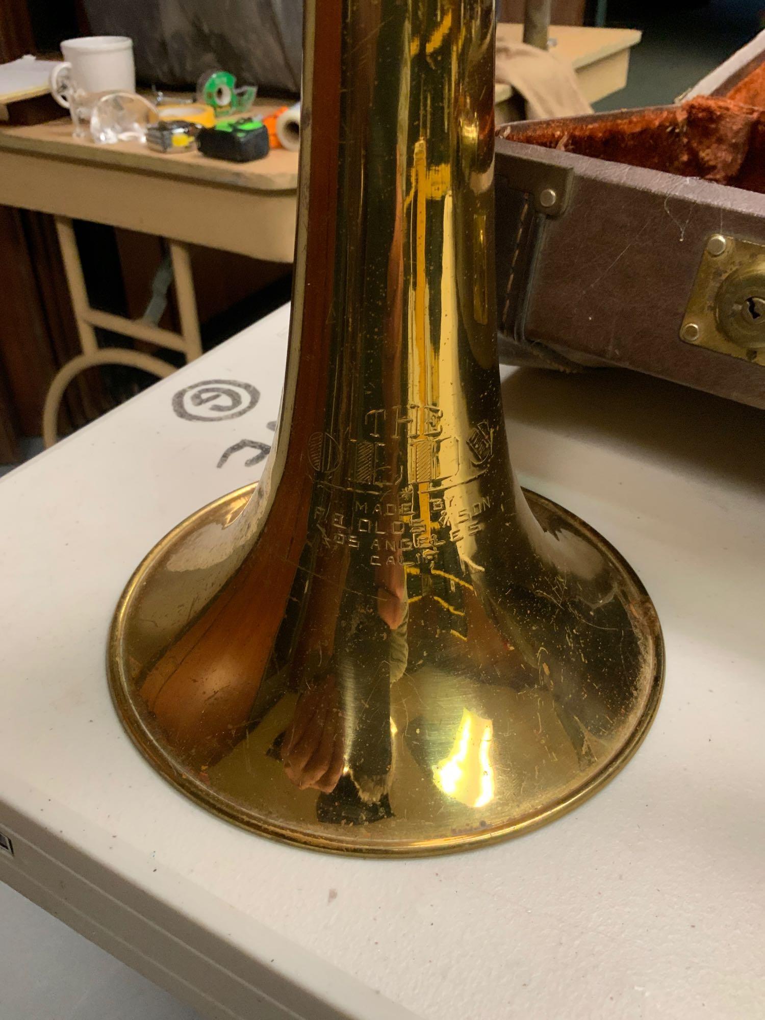 Trombone: Trombone the old made by FE olds and son Los Angeles California..With case I see very few dings or dense in the horn patina it is OK slide works fine...