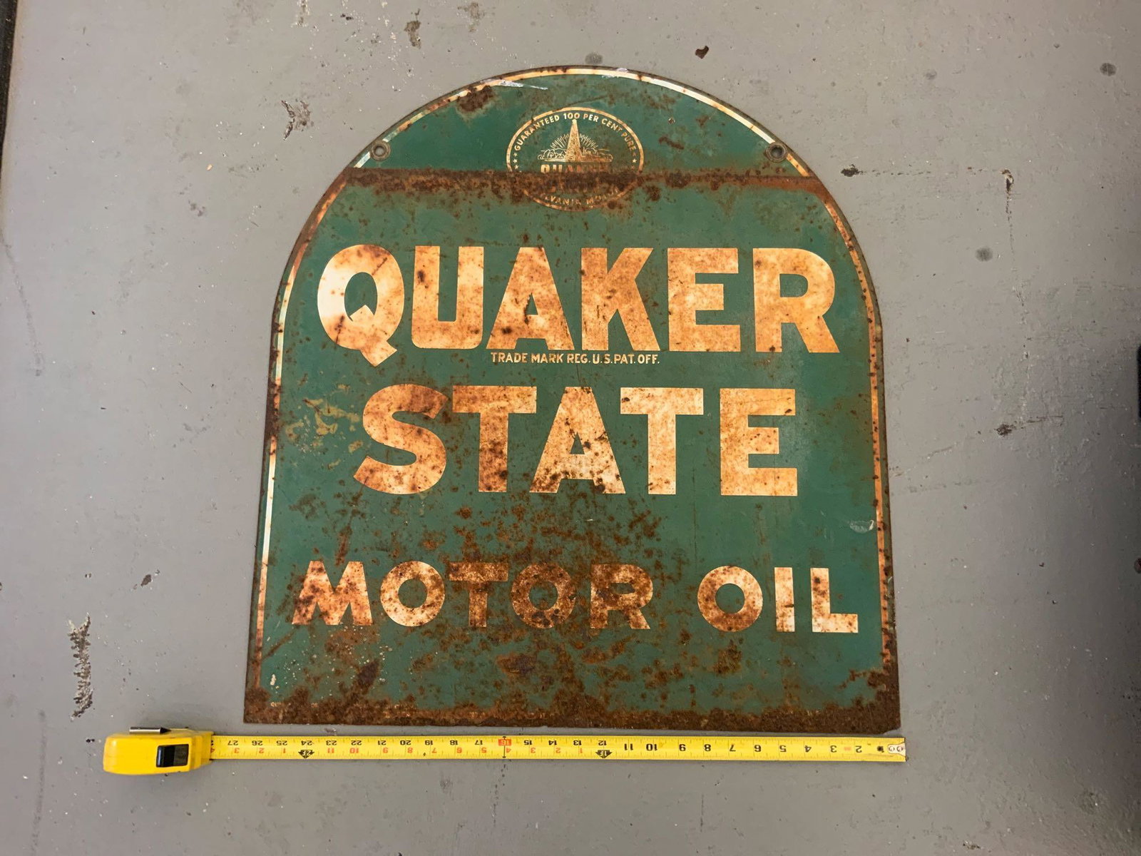 Quaker State motor oil metal porcelain sign: Quaker State motor oil metal porcelain sign, with trademark registered US patent office half circular on top guaranteed 100% pure Pennsylvania motor oil... approximate size 27 inches wide by 29 inches