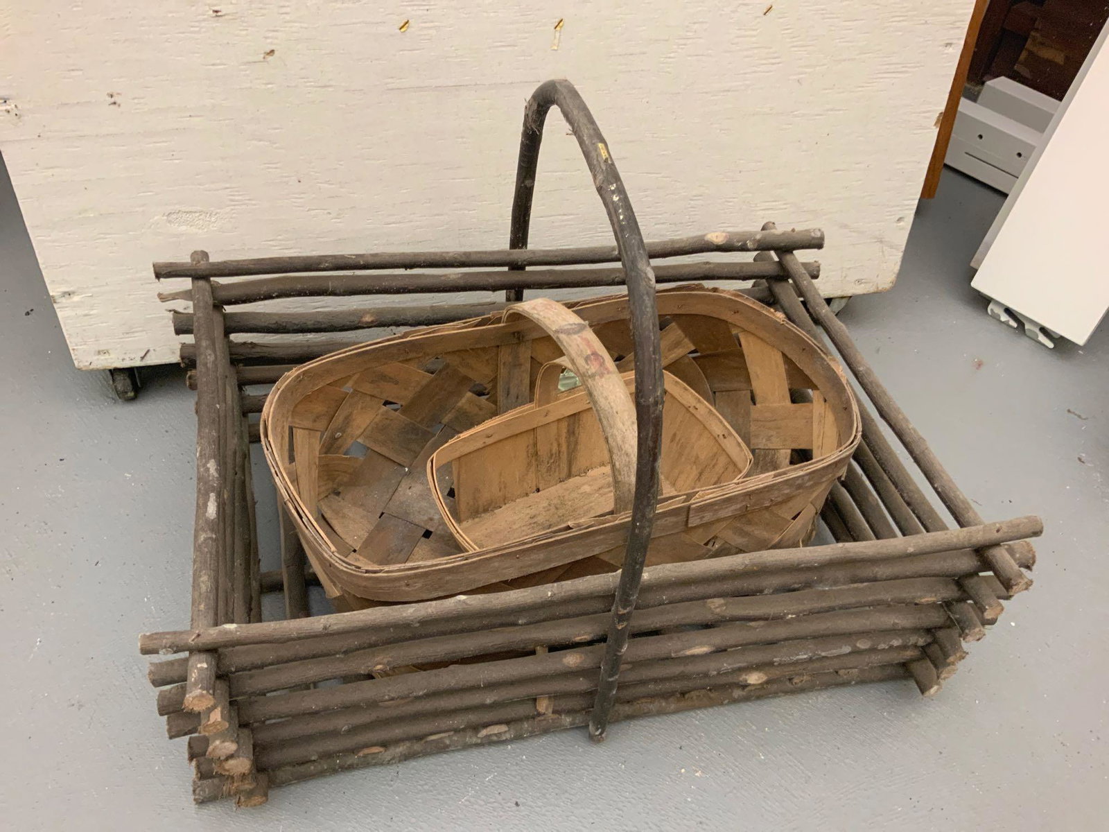 Three antique baskets: Three antique baskets largest one is 16 inches high with the handle by 24 inches long by 18 inches wide, referred pictures all won money..