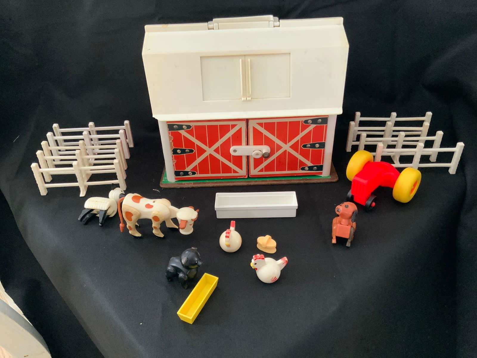 Fisher-Price family play farm: Fisher-Price family play farm with one cow two chickens one pig in trough brush dog and sheep and tractor end nine pieces of fencing...