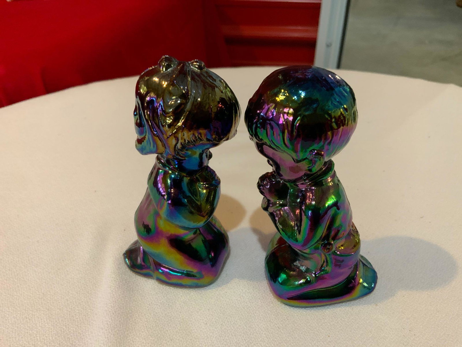 Fenton, purple Carnival glass, praying boy and girl (1 of 3)