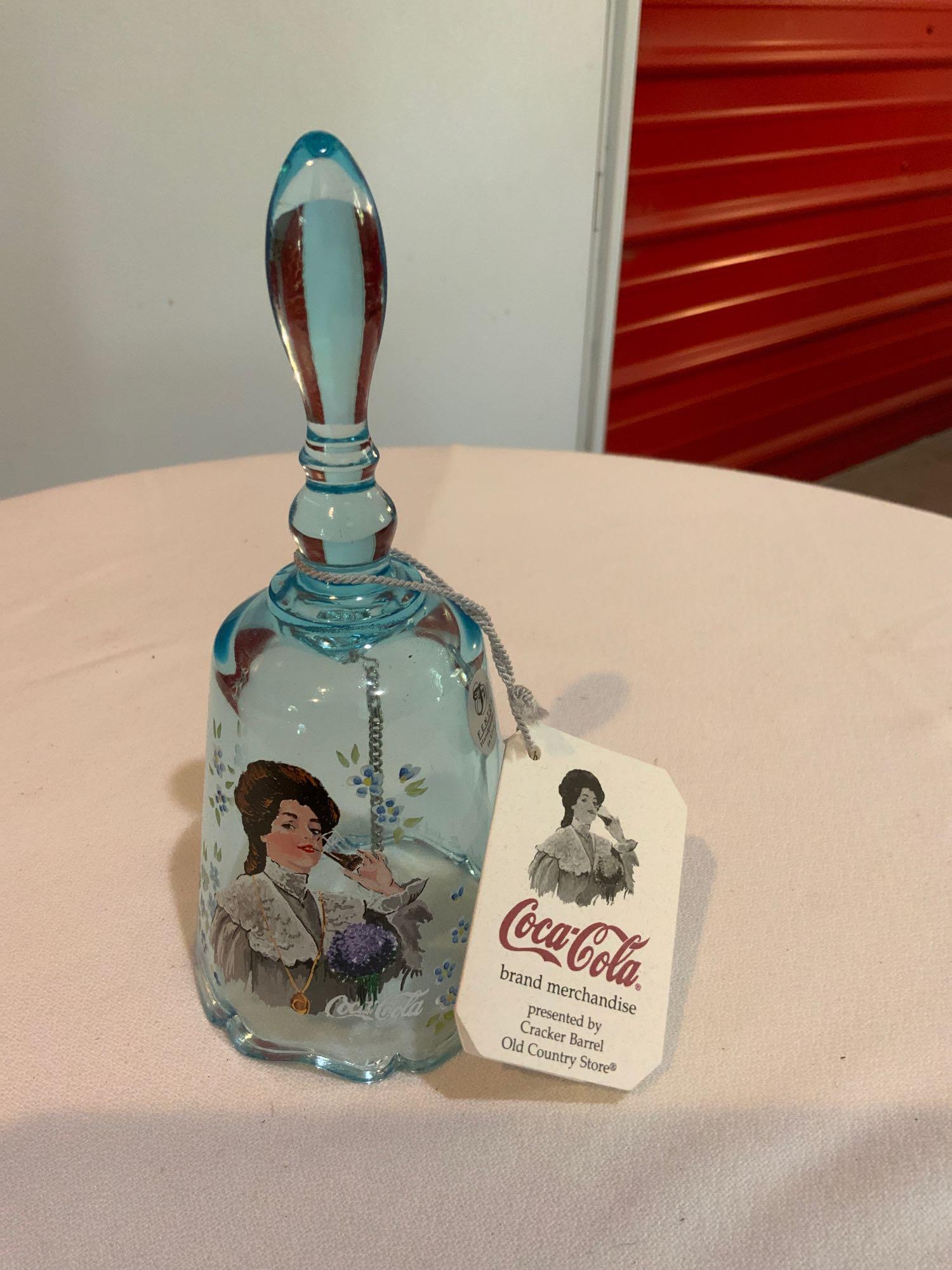 Fenton, Blue topaz coca-Cola bell: Fenton, Blue topaz coca-Cola bell, Handpainted and Signed by the artist in great condition no chips or cracks also with a tag