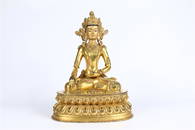 A GOLD GILDING GAUTAMA BUDDHA STATUE