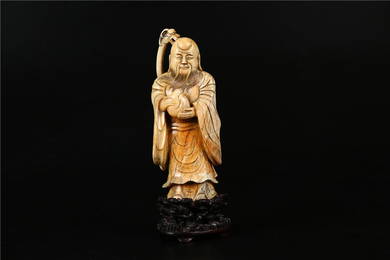 A HETIAN JADE MADE LONG-LIVE GOD STATUE