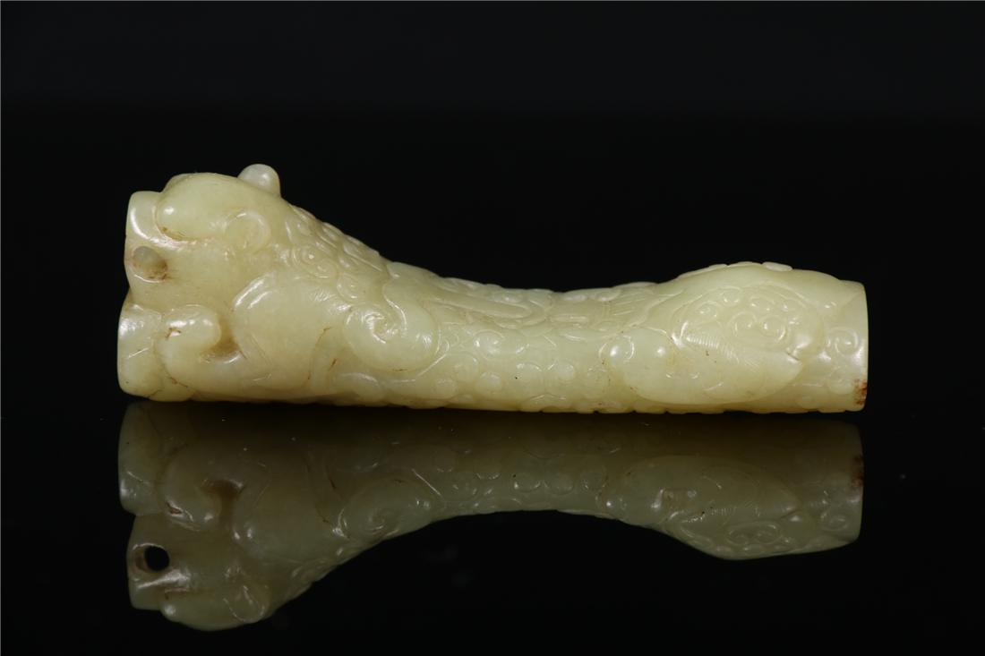 A JADE AUSPICIOUS BEAST SHAPED ORNAMENT (1 of 7)