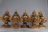 A SET OF GILT BRONZE SUPARNA BUDDHIST IMPLEMENTS