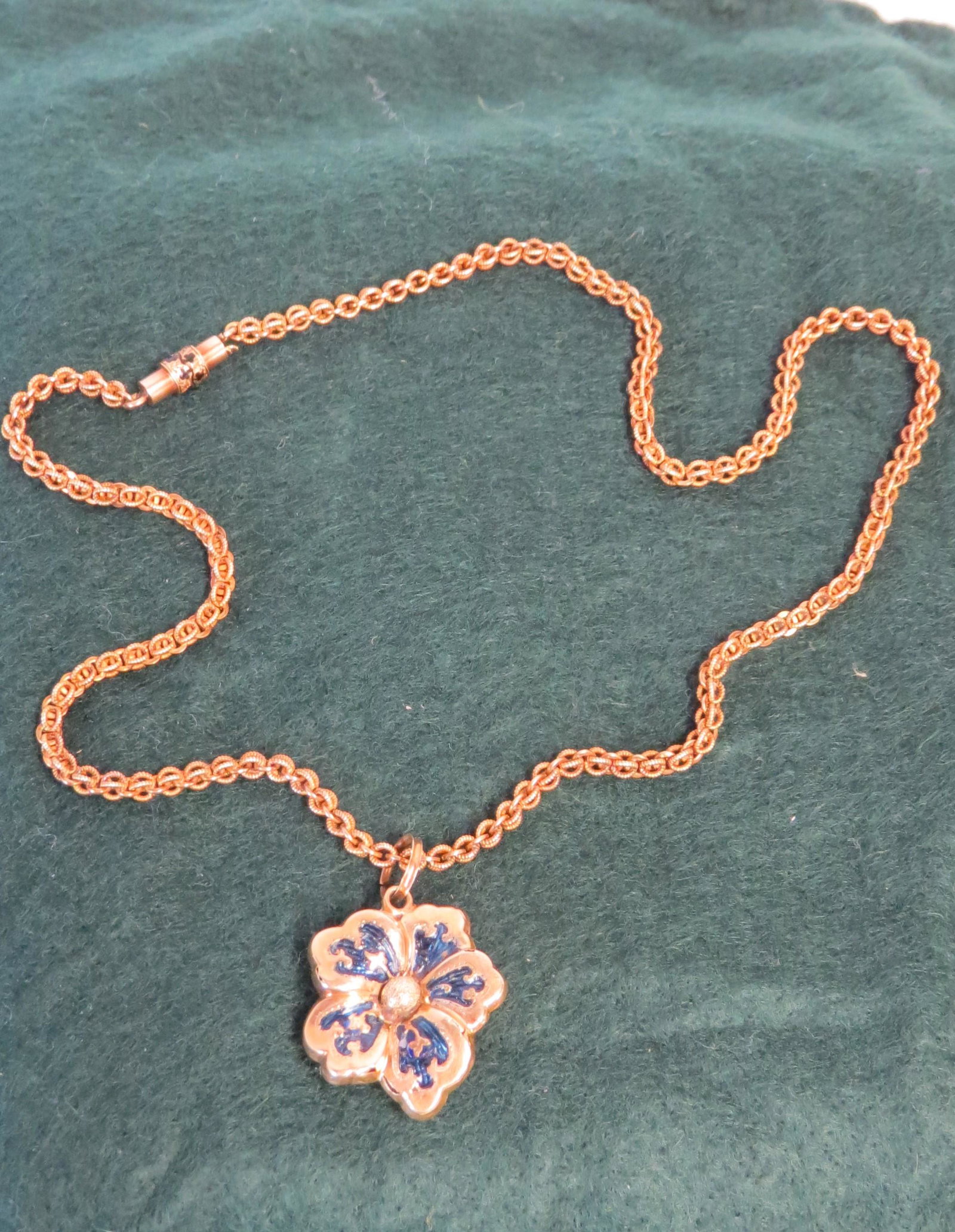 Gold Locket: Gold and blue enamel locket pendant with silver center, back opens up to reveal a tin type portrait of a gentleman, gold chain 7.95 dwt, pin has a hole worn through tests 14K, 1.86 dwt