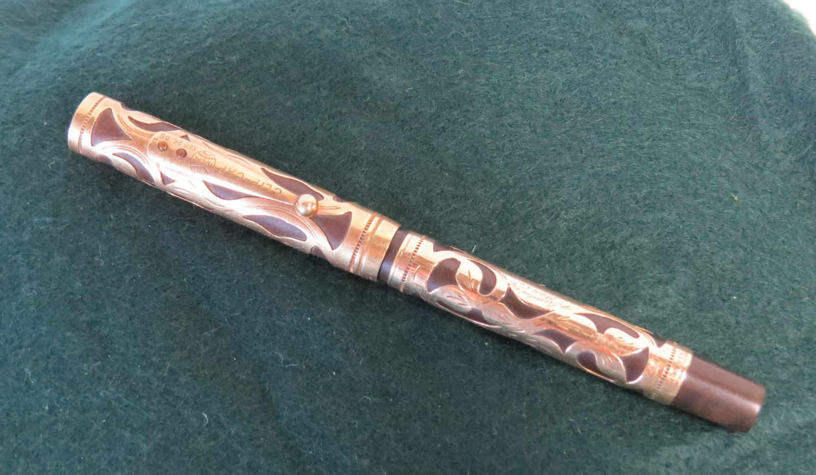 Fountain Pen: Ideal Presentation fountain pen with 14K gold overlay, 5 ½", Presented by Mon. Co., Grand Jury Mat Tern, 1910 to their esteemed foreman Benj. J. Parker. Has number 515 embossed on butt of pen.