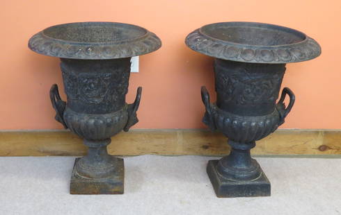 Pair Neoclassical cast iron garden urns: Pair Neoclassical cast iron garden urns with Lions head handles, 24&rdquo; h. x 18 &frac12;&rdquo; diameter top, both good condition