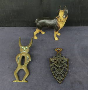 Lot Terrier door stop, boot jack, flatiron: Lot containing Terrier door stop with original paint, brass devil boot jack, bronze flatiron trivet with VM mark