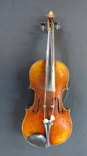 Violin and case with two bows: Violin with label reading Antonius Stradiuarius Cremone Faciebat Anno 17 with (A cross S ) in a circle, can not depend on labels, body is 15 &frac12;&rdquo;. Length is 26&rdquo;, violin and hard-shell