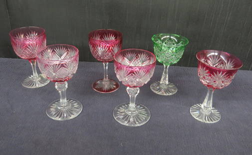 Lot six American Brilliant cut glass overlay stems: Lot six American Brilliant cut glass overlay stems all 4 &frac12;&rdquo; h. two cranberry overlay with strawberry diamond and fan pattern, one green hobstar with ray base all 4 &frac12;&rdquo; h. two