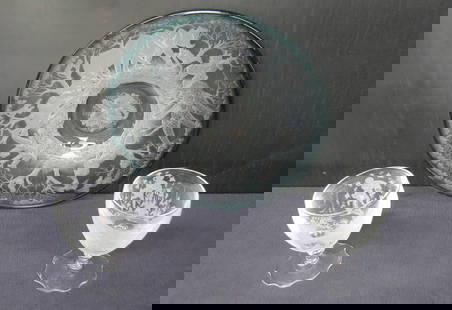 Pair American Brilliant cut glass goblets, Plaque etched with exotic animals: Pair glass goblets engraved with Goddess and putti 5 1/2:&rdquo; h. x 3 &frac34;&rdquo; diameter one has tiny flake on base, Plaque etched with exotic animals and floral center, has green border and e