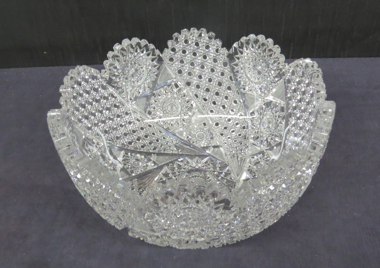 American Brilliant cut punch bowl: American Brilliant cut punch bowl in a variation of the Comet pattern, minor roughness on some teeth, 12” d. x 6” h.