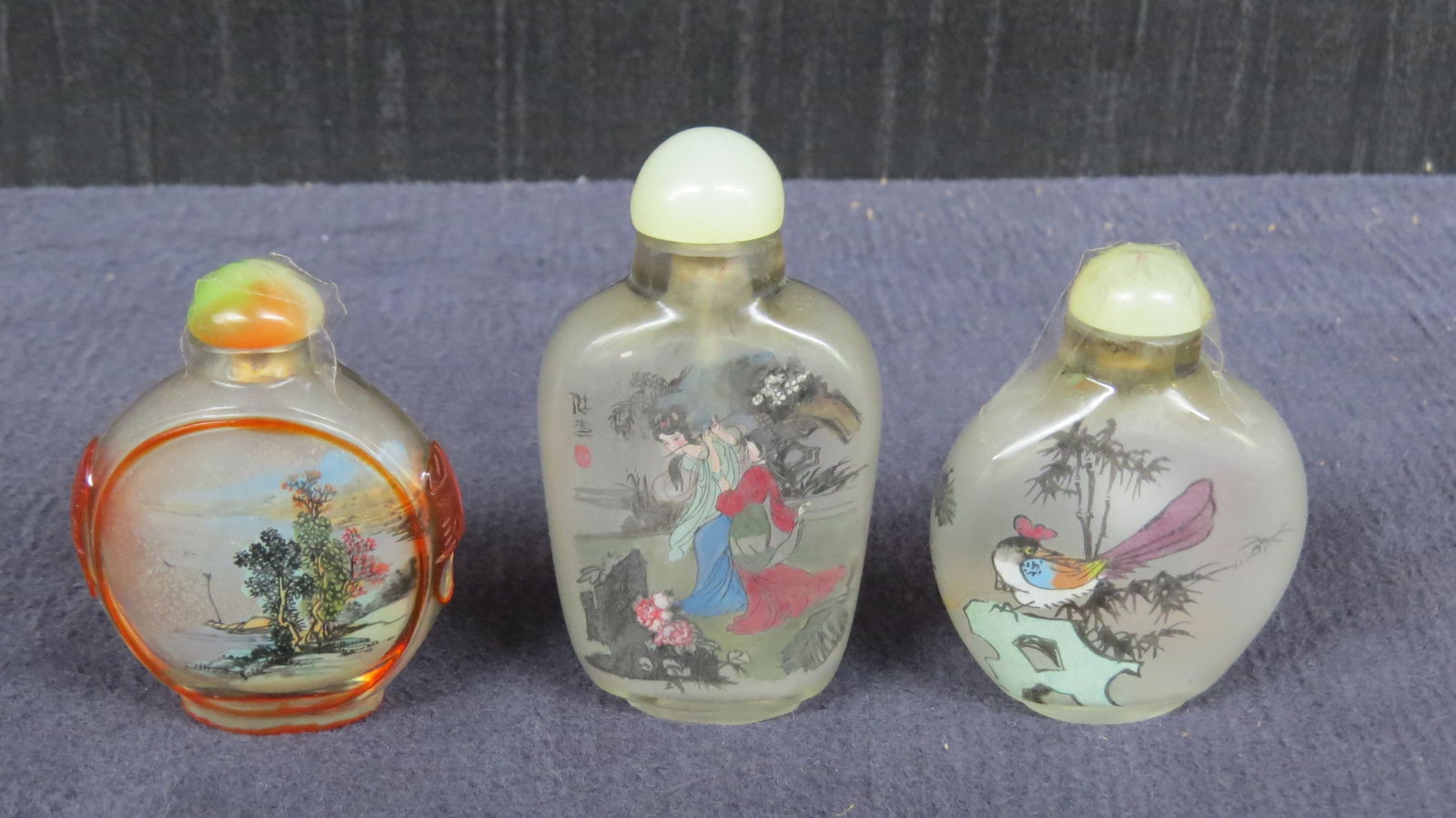 Three Japanese snuff bottles with painted scenes (1 of 3)