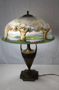 Reverse painted Pairpoint table lamp: Reverse painted Pairpoint table lamp with 17 &frac12;&rdquo; diameter shade in Apple Blossom pattern, flared rim shade is signed The Pairpoint Corp., and also signed Palme, lamp stands 24&rdquo; h., B