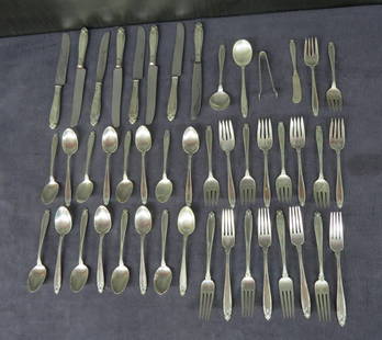 Partial sterling silver flatware set: Partial sterling silver flatware set “prelude&rdquo; pattern by International silver Co. consisting of 2 soup spoons, tongs, butter spreader, 8 dinner knives with stainless blades, 8 dinner forks, 1