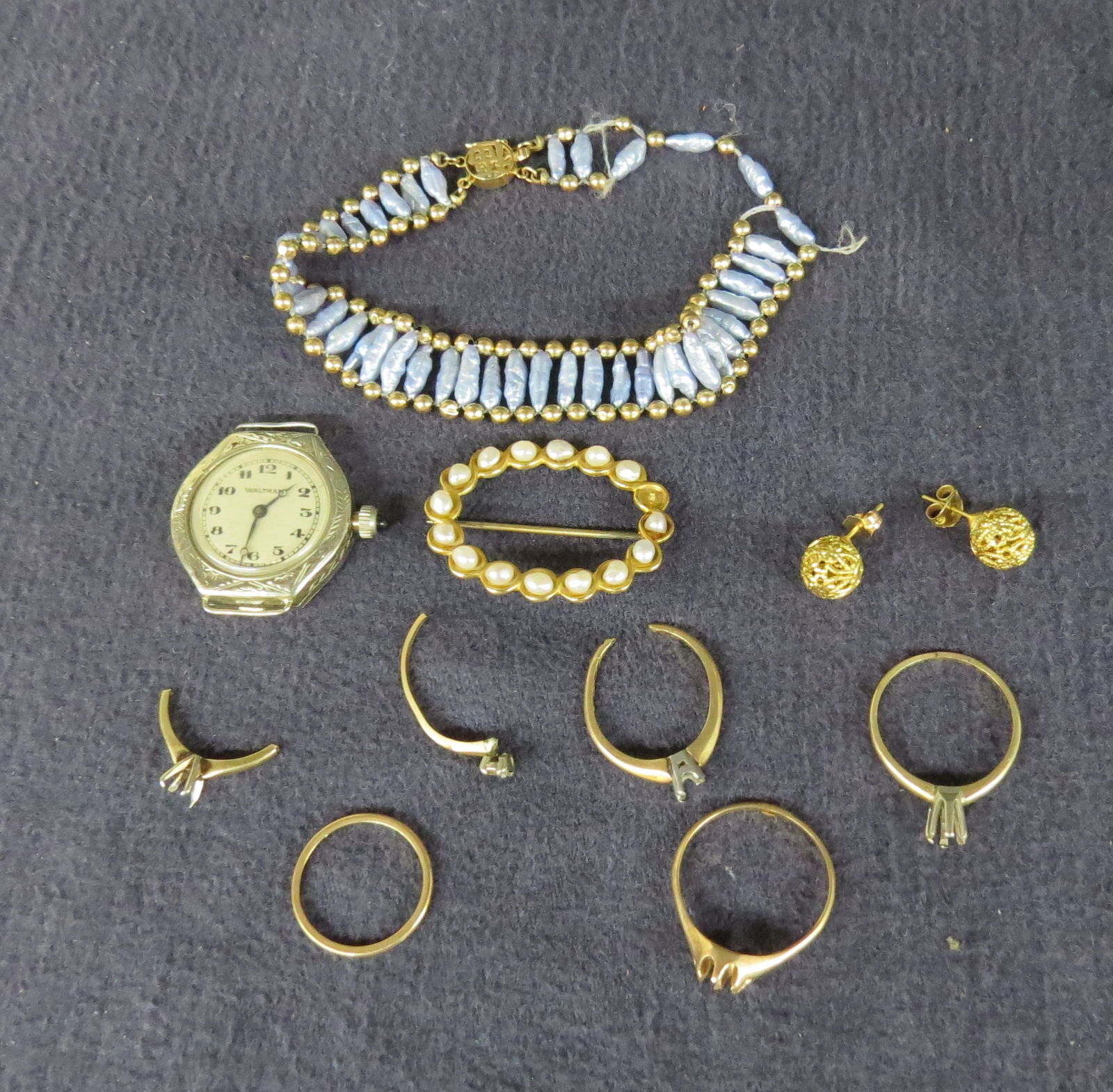 Lot 14K jewelry as is: Lot 14K jewelry as is, gold bead and pearl bracelet coming unstrung, Waltham Ladies watch no strap, pearl pin missing one pearl 2.6 dwt, pair ball earrings .86 dwt and lot scrap settings 6.15 dwt.