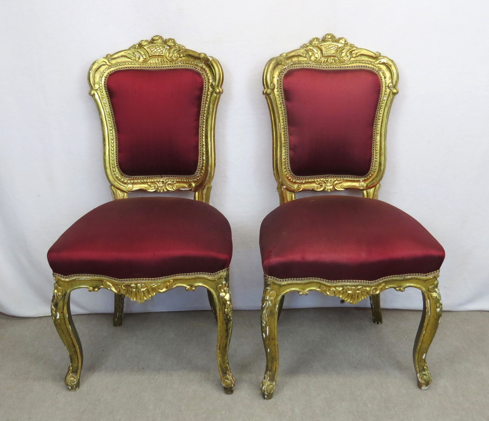 Pair gold leaf side chairs: Pair gold leaf side chairs 40” h. 19” seat height