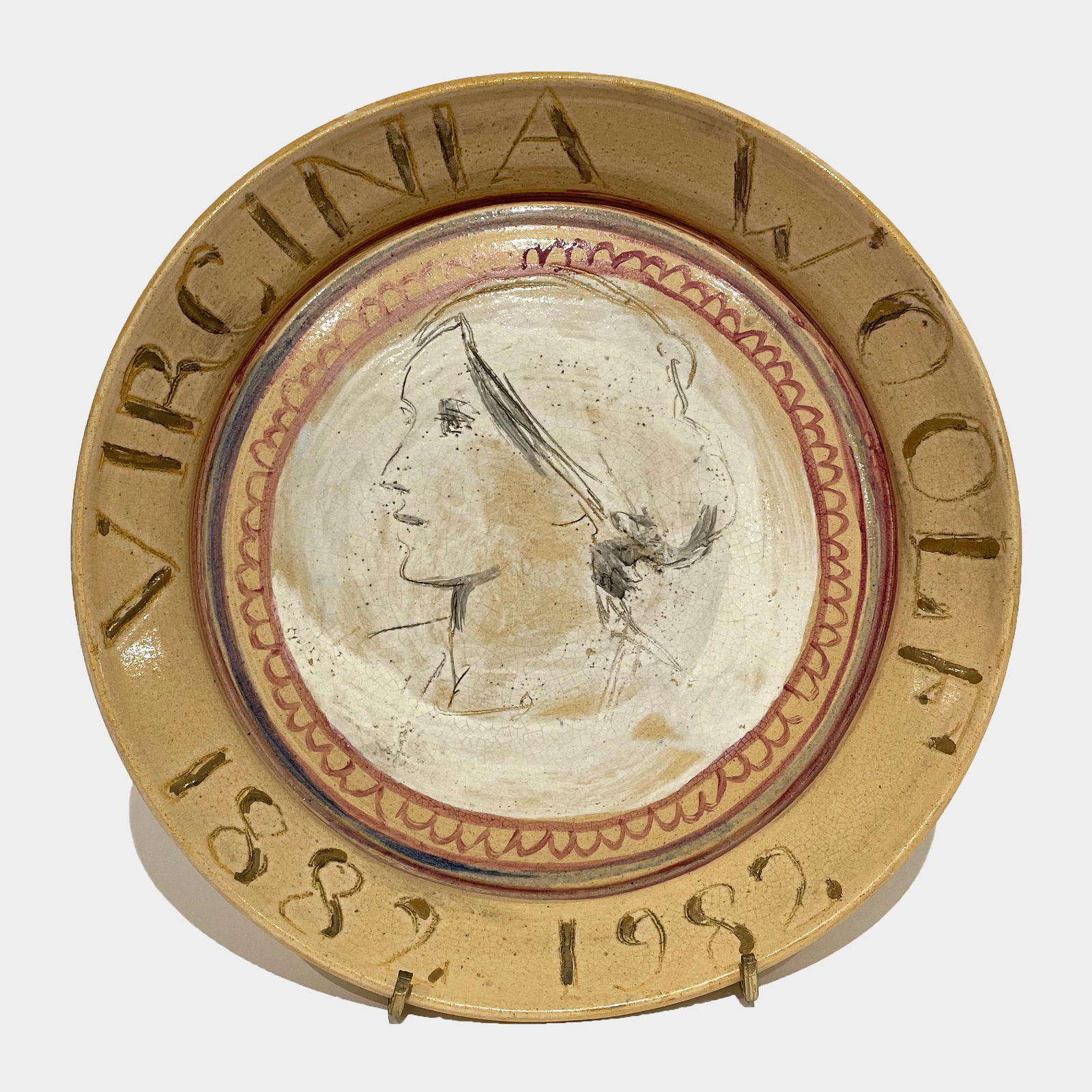 Quentin Bell (1910 - 1996): "Virginia Woolf, 1882 - 1982"; Glazed Ceramic; 9.125" diameter; Signed on Bottom; Note: A Fulham Pottery portrait plate, 'Virginia Woolf' by Quentin Bell, marking the centennial of the author's birth.