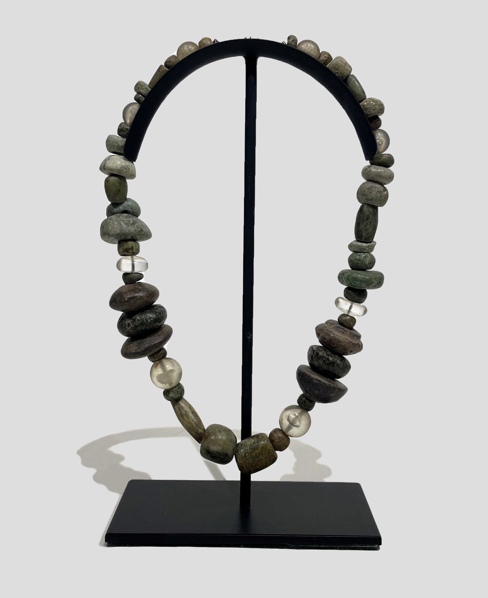 Antique South American Necklace: Antique South American Necklace Made of Spindle Whorls and Various Natural Stones with Professional Stand Mount; n.d.; 23.25" long; Provenance: From the Estate of Marcuse "Cusie" Pfeifer (1936 - 2020)