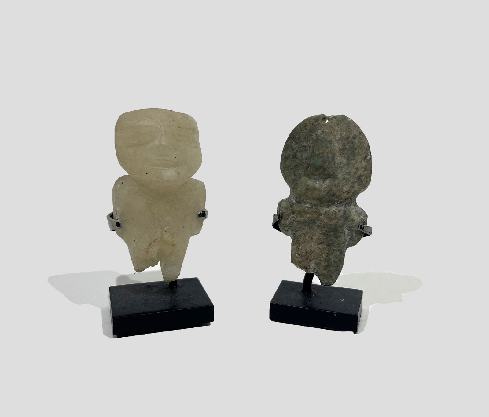 Two Antique South American Fetish Figures: Two Antique South American Fetish Figures with Professional Stand Mounts; n.d.; Quartz and Granite; 1.75" x 1" x .25" (granite) / 2" x 1" x .75" (quartz); Provenance: From the Estate of Marcuse "Cusie