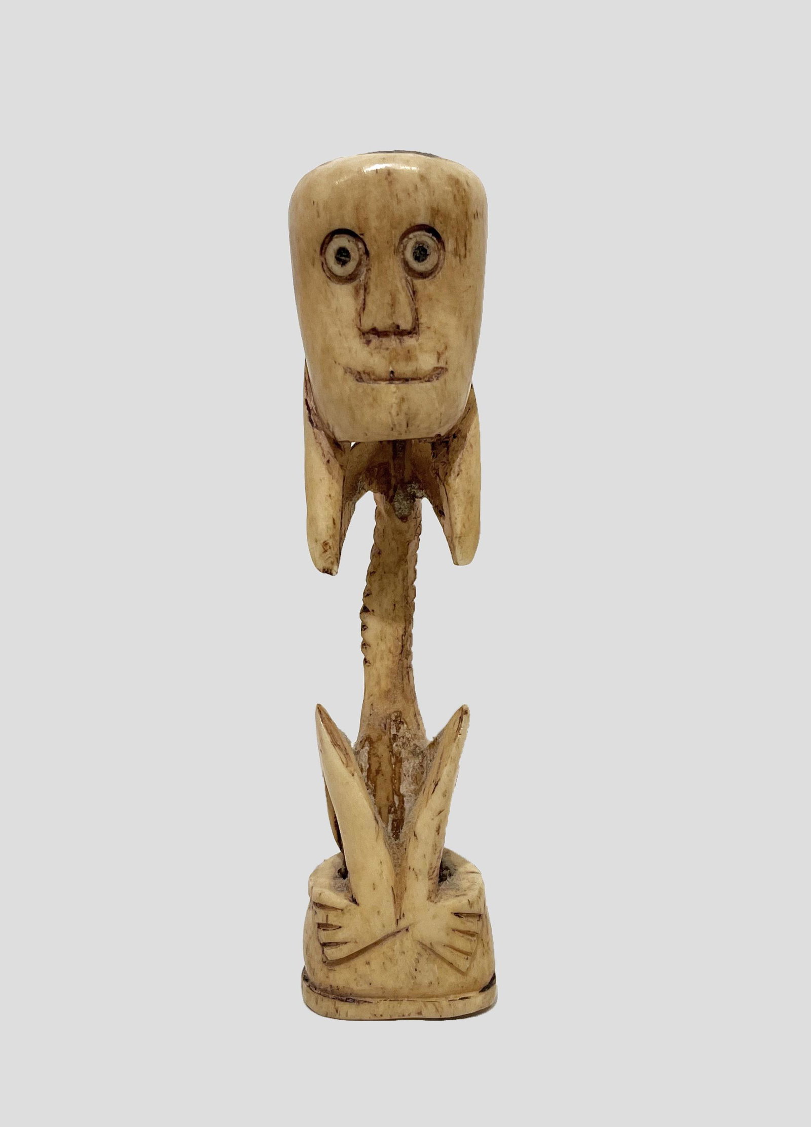Carved Bone Dayak Borneo Figure: Carved Borneo Stick Dayak Statue; 19th Century; Carved Bone (Possibly Deer); 4.25" x 1" x .75".