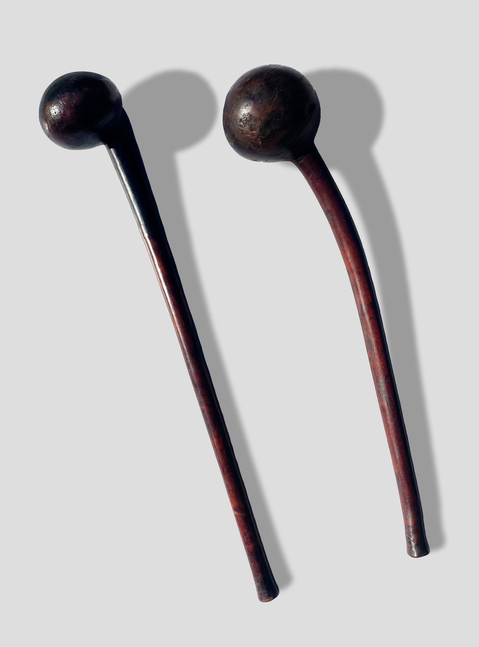 Two Early African Zulu (?) Knobkerries: LOT OF TWO EARLY AFRICAN ZULU (?) KNOBKERRIES; n.d.; Carved Wood; 19" long.