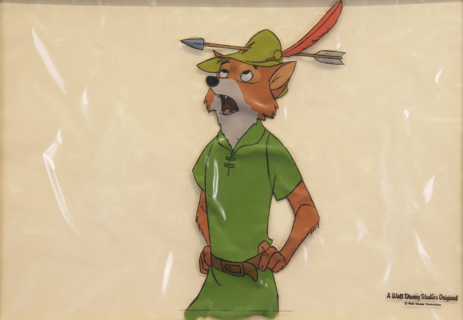 Walt Disney Studios "Robin Hood" Animation Cel: "Robin Hood"; 1973; Hand Painted Animation Cel on Acetate; 9.25" x 13.25"; Stamped "A Walt Disney Studio Original (copyright Walt Disney Productions)" Lower Right; Framed (under glass).