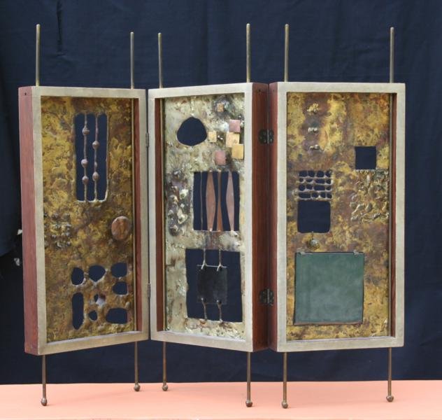 Eduardo Chavez (1917-1985): Tryptich, c. 1960, Pierced, Braised and Soldered Copper and Brass Stained Glass and Wood, 21.5" x 7.5" overall, including legs and finials; 14.5" x 7.5" per panel, Unsigned.