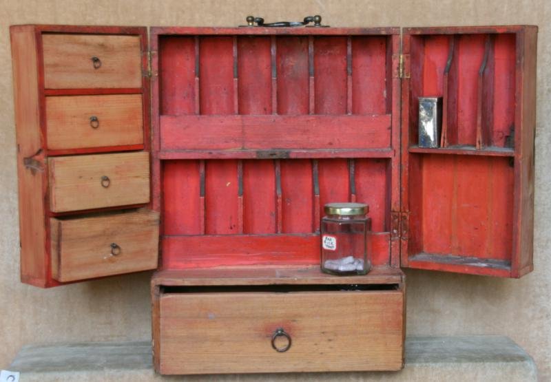 Unknown: Traveling Apothacary Cabinet, c. 1860, Wood and Brass, 17" H x 13" W x 8" D, NA. Illustrated in Anne Young's book "Antique Medicine Chests". Hidden panel in rear.