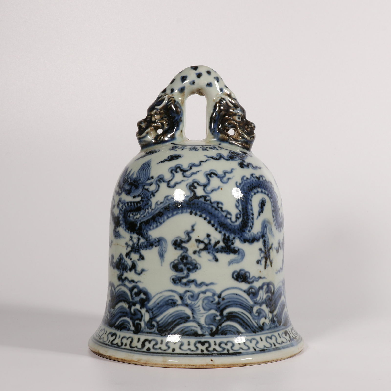 A blue and white 'dragon' small bell (1 of 6)