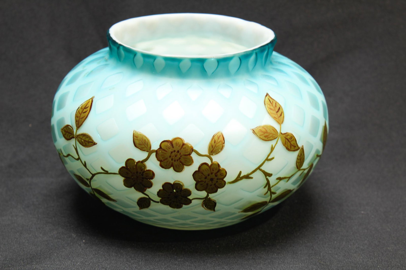 Webb Satin Victorian Glass Mother of Pearl Large bowl: A beautiful Victorian blue satin glass Mother of Pearl diamond quilt large bowl or ferner with applied gilt decoration. Signed Webb. Measures: 4 1/2" tall, 7" wide. Condition: Excellent