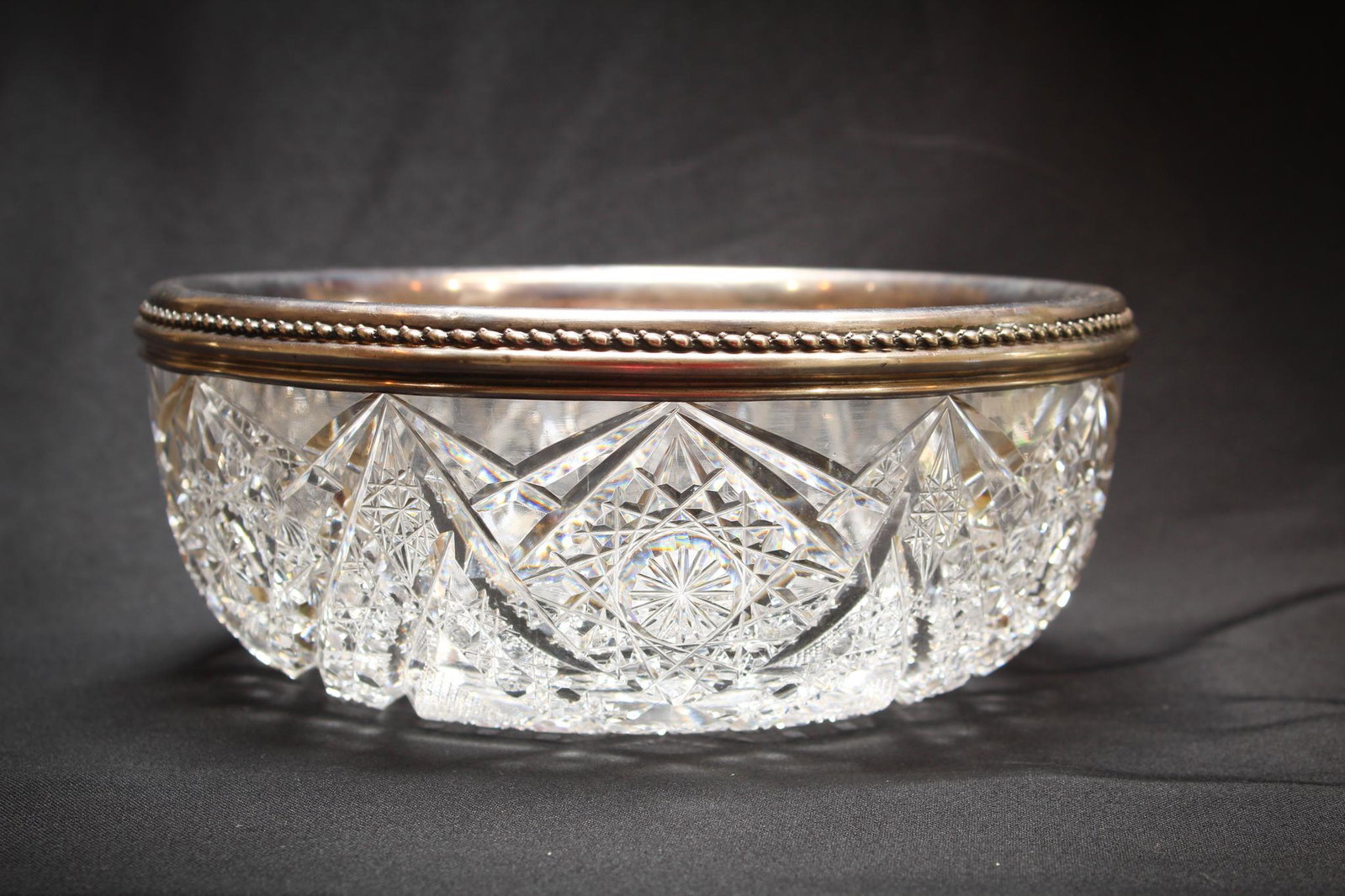 ABP Cut Glass Bowl w/ Gorham Sterling Mounts: A stunning ABP Cut Glass Bowl with signed Gorham Sterling Mounts. Beautiful! Measures 3 3/4" tall, 9" wide. Condition: Excellent