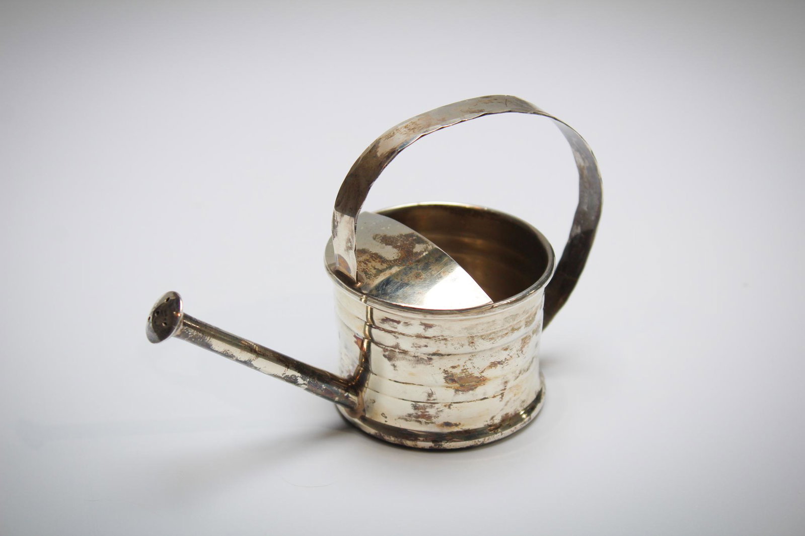 Cartier Sterling Watering can Vermouth Infuser: A Charming Cartier Sterling Silver Vermouth Infuser in the form of a watering Can. Measures: 3" tall, 4 1/2" wide. Condition: Excellent