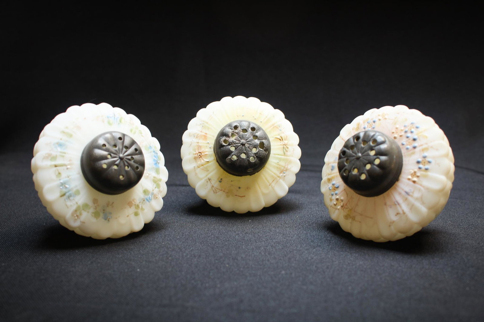3 pc Lot Victorian Daisy Salt Shakers: Beautiful lot of 3 Victorian satin enameled Flat daisy salt shakers. Nice deccoration and seldom seen form. Measures: 1/2" tall, 2 1/2" wide. Condition: Excellent