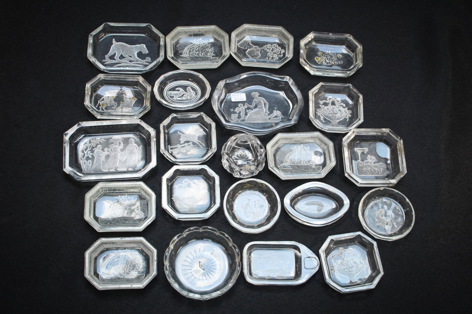 22pc Lot Intaglio Open Salts: A lot of 22 Intaglio cut Open Salts. Large grouping Condition: Minor chipping to edges on a number of them.