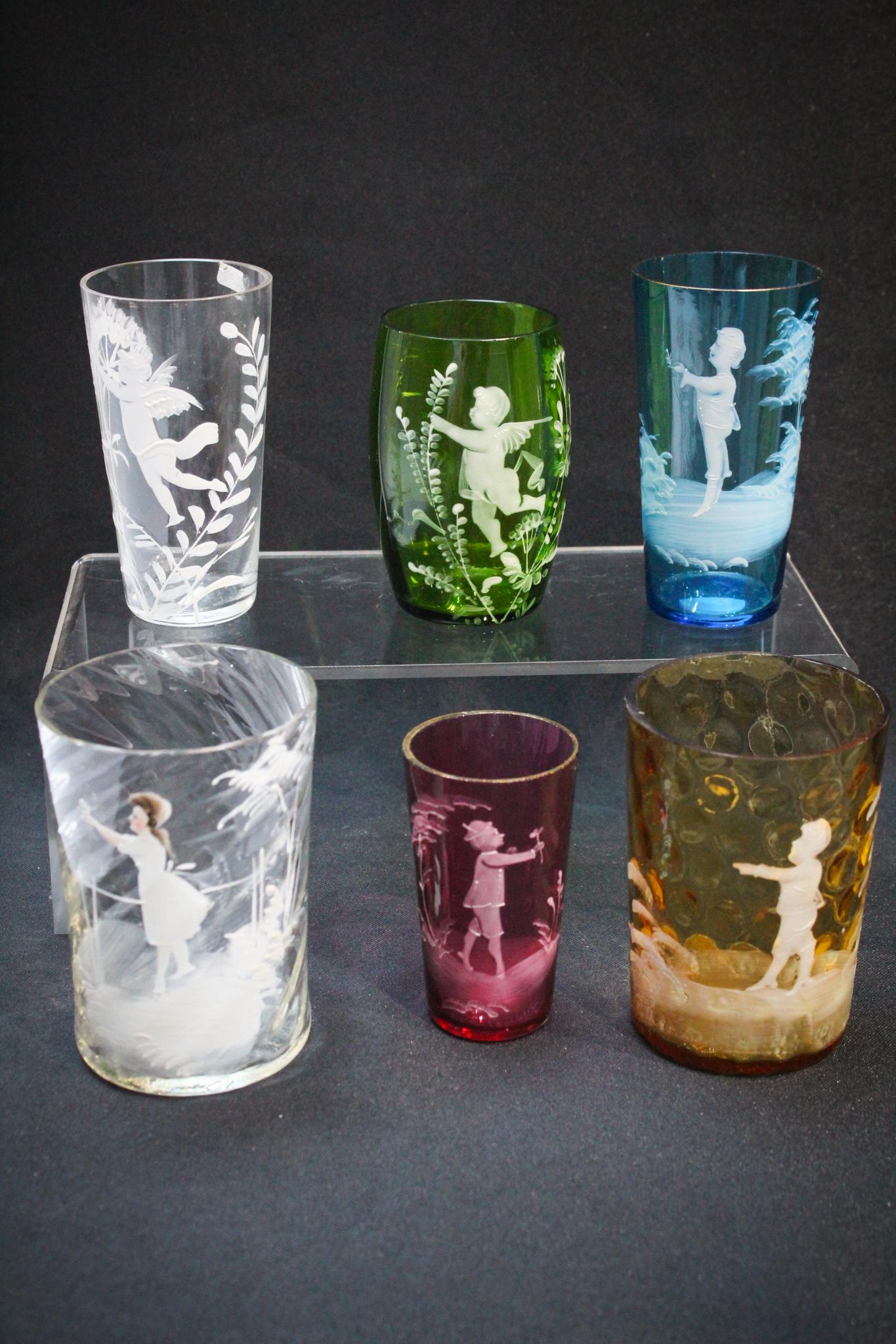 6 Mary Gregory Victorian Tumblers: A wonderful lot of 6 Mary Gregory dÃ©cor Victorian tumblers in an array of colors and sizes. How nice is this lot? Tallest measures: 4" tall, 3" wide. Condition: Excellent