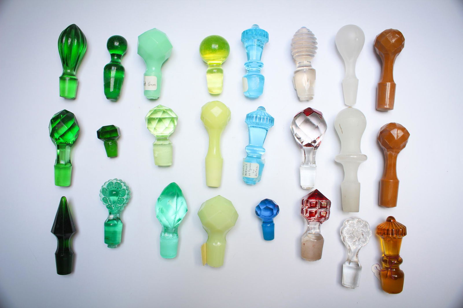 24 pc Lot Victorian Antique Cruet Decanter Bottle: Another Super lot of 24 Victorian Colored and Antique Cruet, Decanter, or Perfume bottle stoppers. Another nice assortment.Again, tough to find this many together. Condition: Excellent less some with