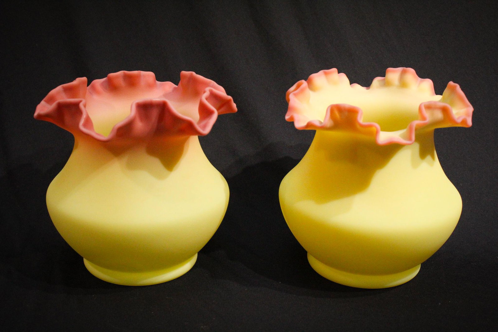 Fenton Glass Burmese satin Pair: Unusual and seldom found together lot of 2 pieces of Fenton Satin Burmese Glass. So velvety soft and eye appealing. Each measures 6 1/2" tall.