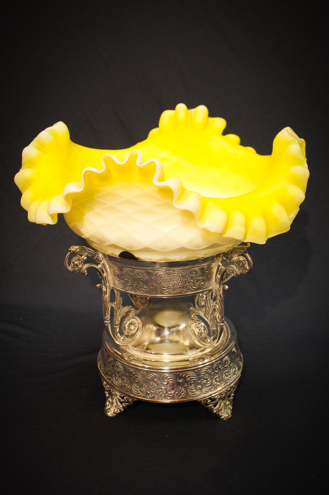 Victorian Mother of Pearl Canary Brides Bowl in: Crisp canary yellow diamond quilt mother of pearl brides bowl with white interior in a signed Rochester silverplate ornate pedestal holder. Super piece. Measures 9 3/4" tall.