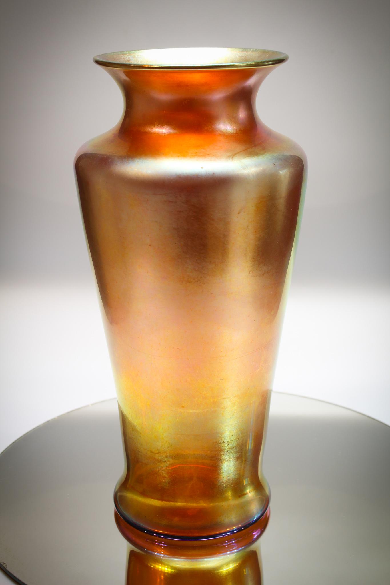 Steuben Monumental Gold Aurene vase #2033: Monumental example of Steuben gold aurene. Numbered 2033 this vase measures 12" tall. Nice gold irridized color. A very showy piece.