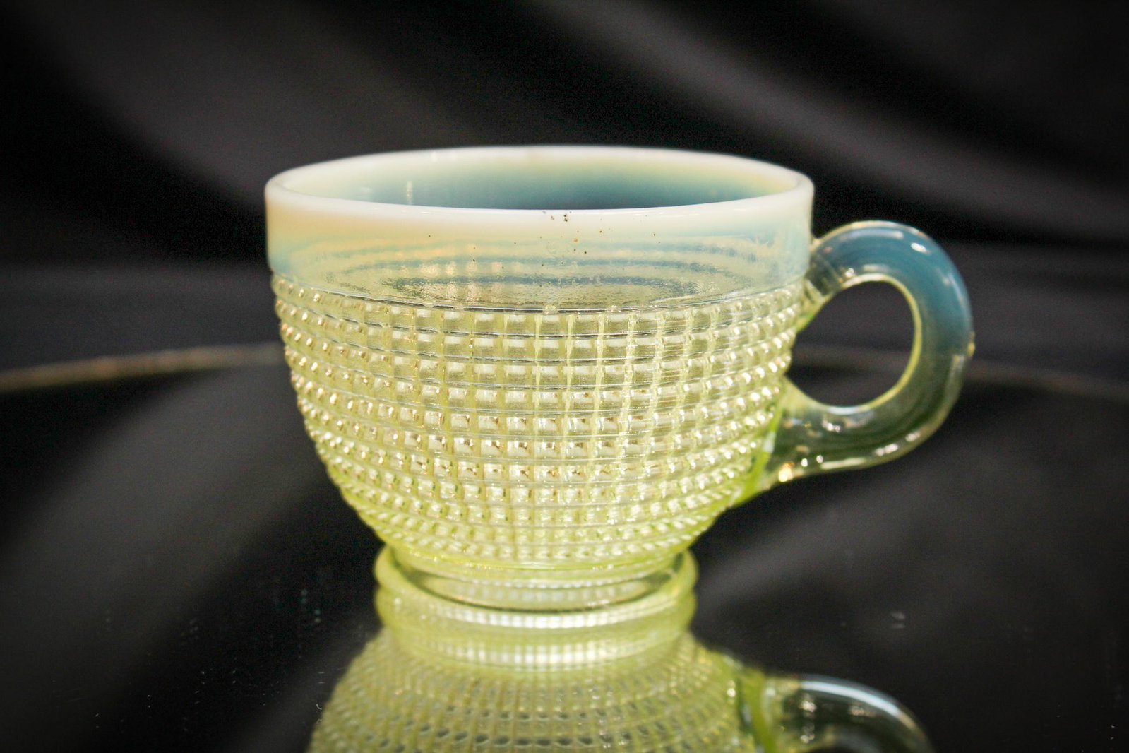 Albany Rib Spiral Vaseline Opalescent cup: Offered is a Vaseline opalescent Ribbed Spiral pattern cup. Nice clean example. Measures 2 1/4" tall.