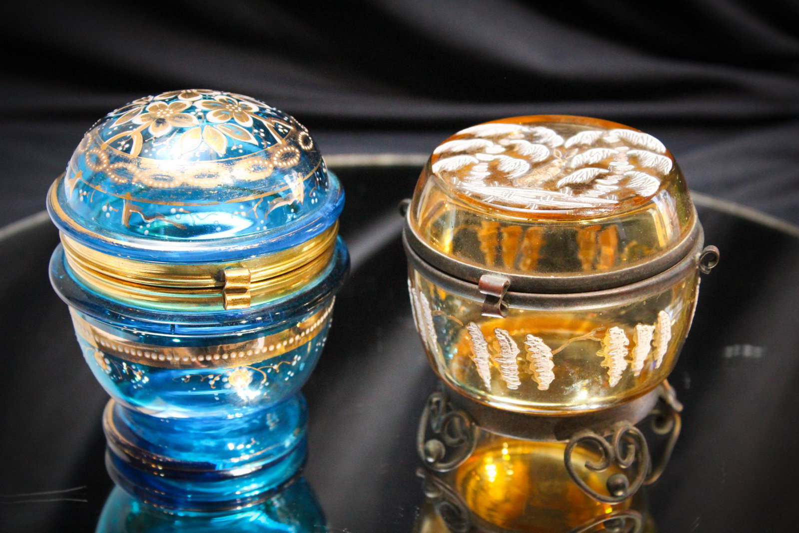 2 pc Lot Victorian enameled Jewel Caskets: Oh these are so nice. A blue floral and gilt enameled example and a Honey amber enameled with rabbit example. Both with original mountings. Tallest measures 4" tall.
