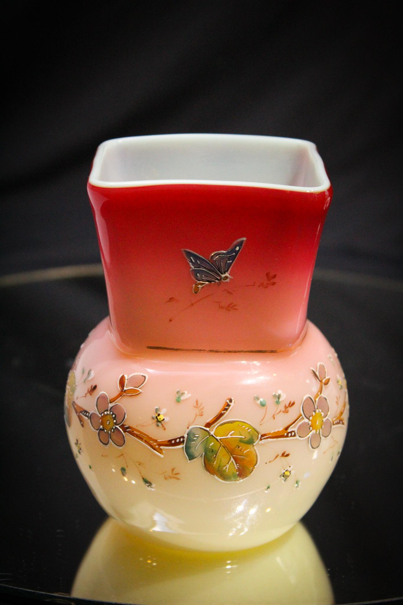 Harrach Peachblow enameled Victorian Cabinet vase bugs: Beautiful Harrach peachblow cased gilt enamel decorated with florals and butterflys Victorian glass vase. Bulbous form and square top treatment to rim. Measures 4 3/4" tall.