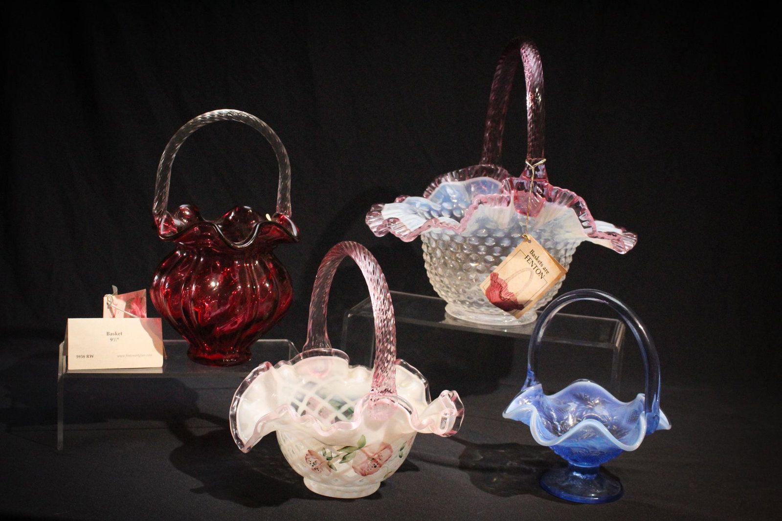 Lot of 4 Fenton Glass Baskets: Lot of 4 Fenton Glass Baskets to include Cranberry, Hobnail, and hand painted. Tallest measures 10" tall.
