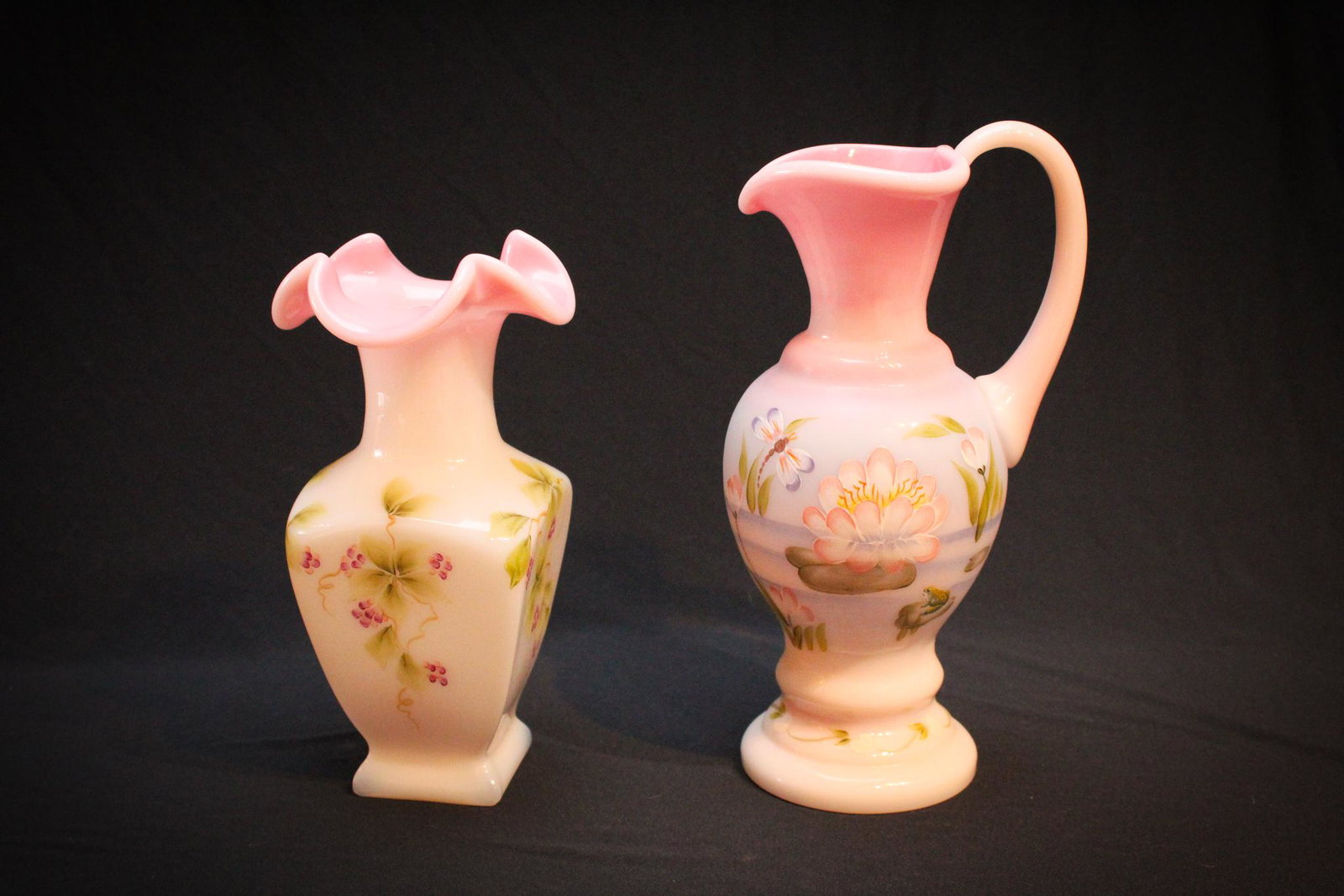 Lot of 2 pieces Fenton Rosalene Glass: Lot of 2 pieces of Fenton Rosalene Glass hand painted examples to include a rare dragon fly and water lily decorated ewer and another fabulous piece with berry decor. Tallest measures 9" tall.