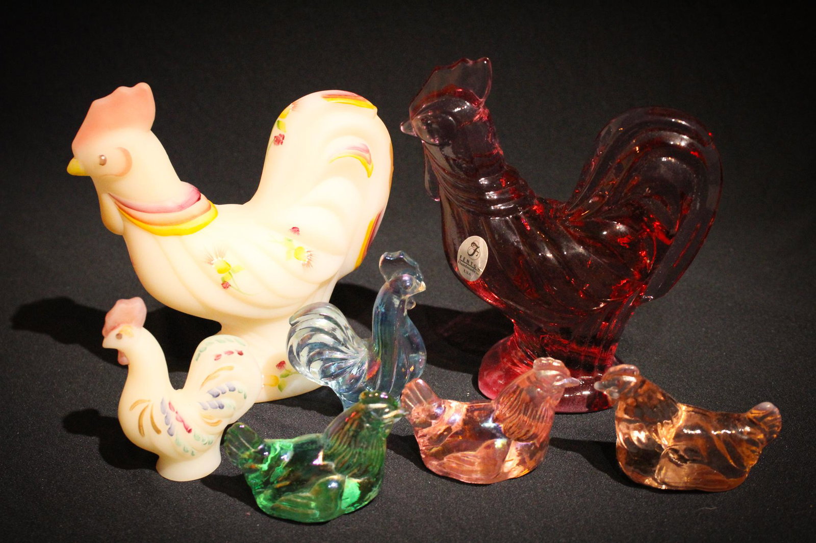 7 pc Lot Fenton Rooster Hen Chicken Figurines: Get a lot of Bock for your buck here! Cock-a-doodle-do. This lot's for you. A 7 piece lot of chickens, hens, roosters. Tallest measures 3" tall.
