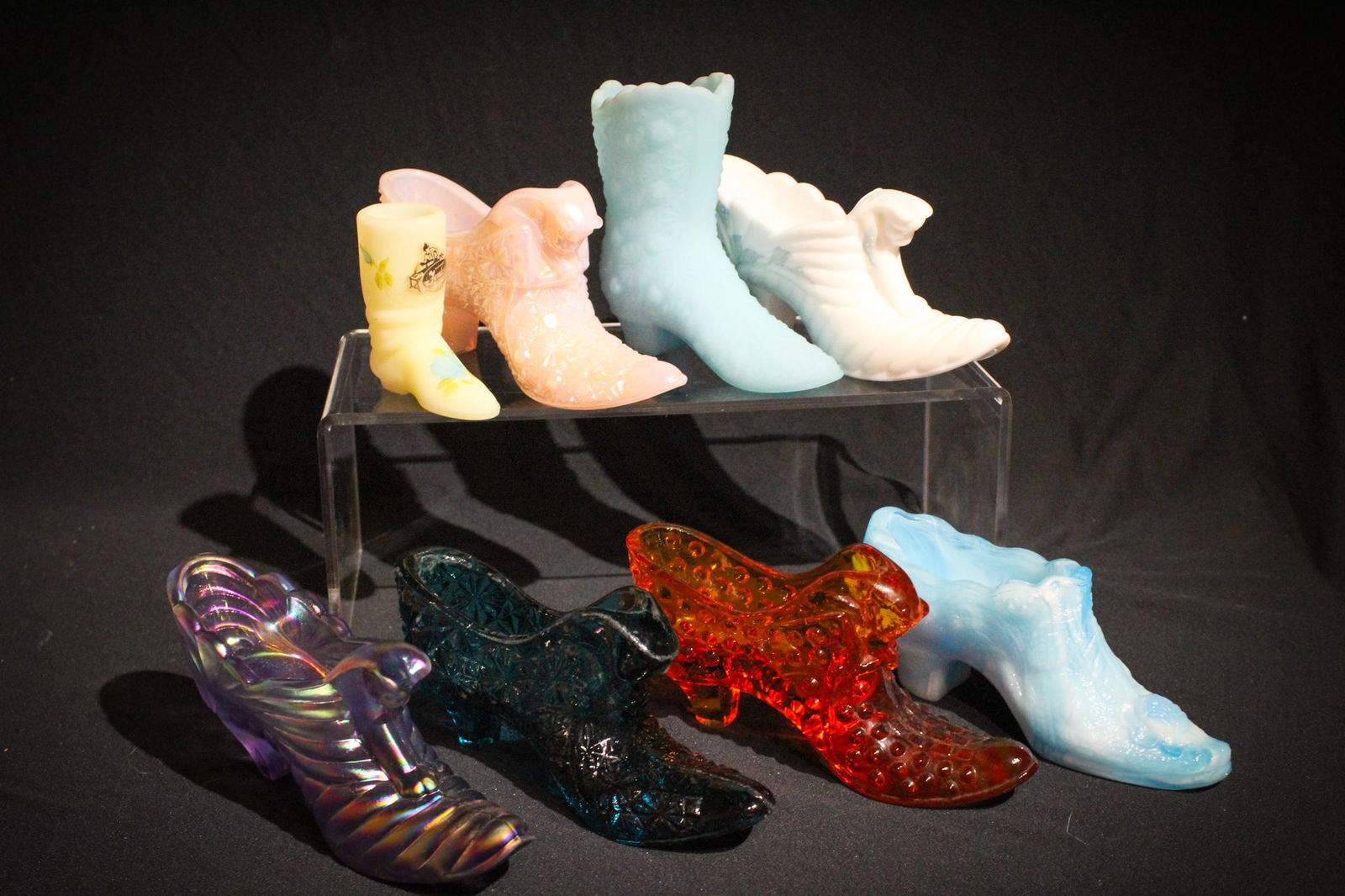 8 pc Lot Fenton Glass Shoes: One sure to fit your collection. Great selection of 8 Fenton glass shoes in varied colors and sizes. Tallest measures 4" tall.